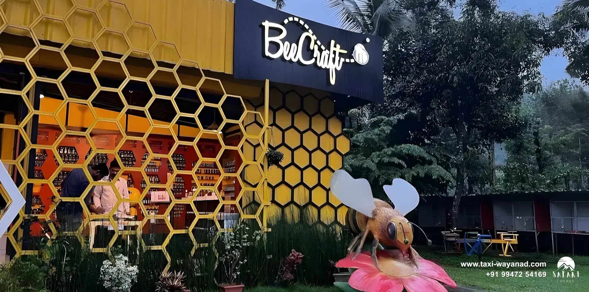 Entrance of the BeeCraft honey museum with a giant bee sculpture, Wayanad