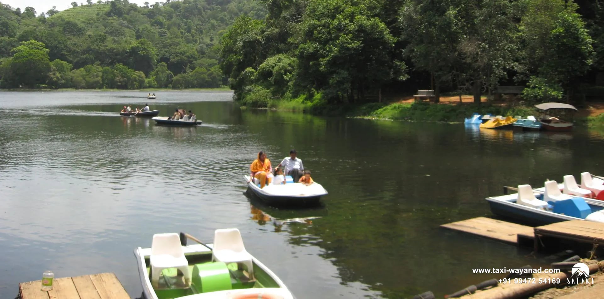 Pedal boats at the jetty and out on the water of Pookode Lake, Wayanad