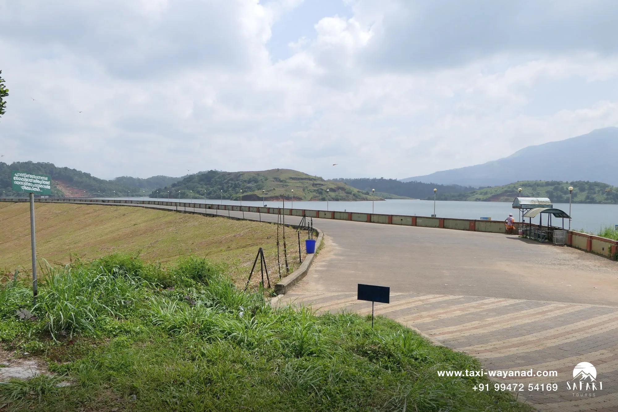 Banasura Sagar Dam walkway over the reservoir, afternoon stop on a Wayanad sightseeing taxi day