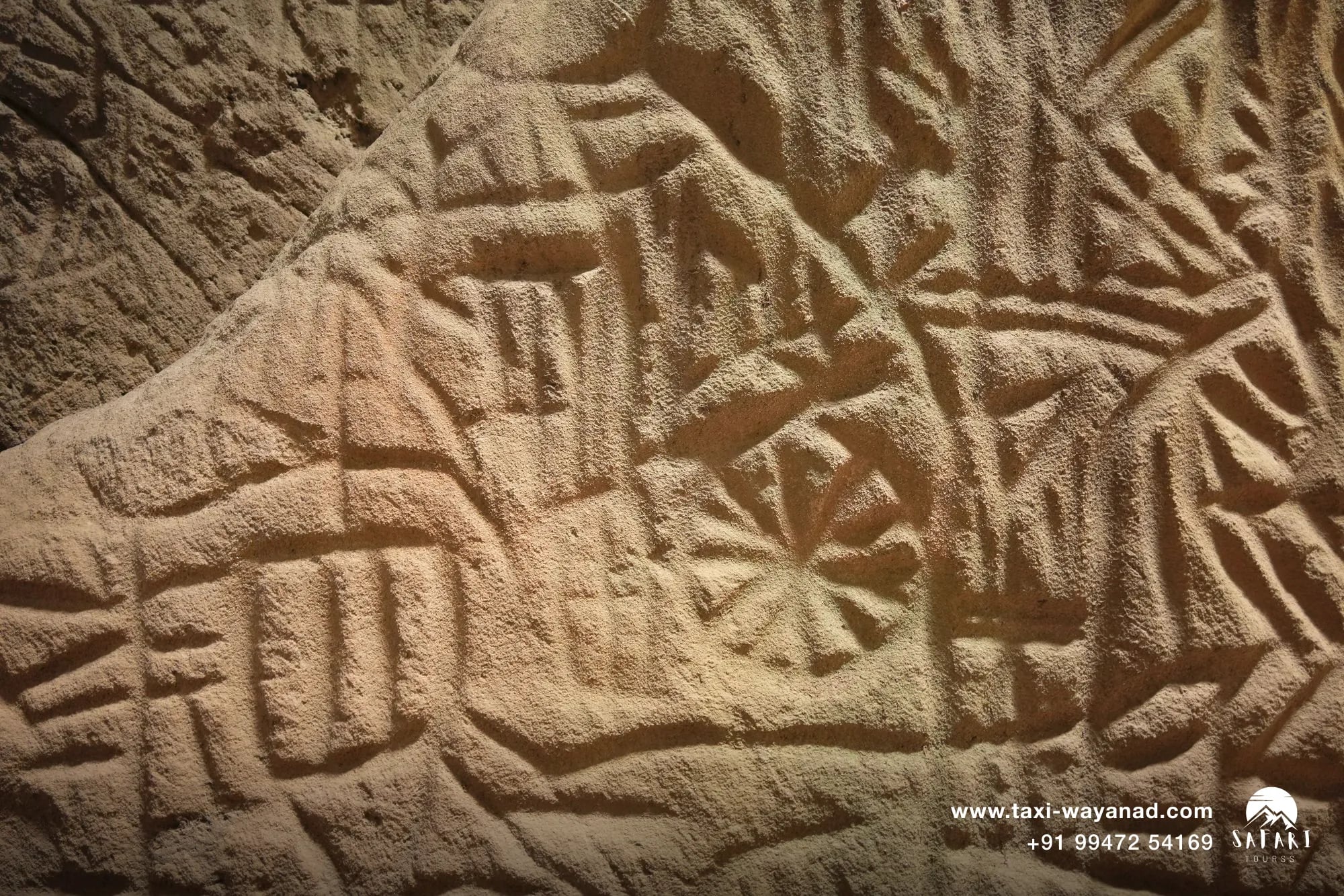 Neolithic petroglyphs inside Edakkal Caves, one of the best places to visit in Wayanad