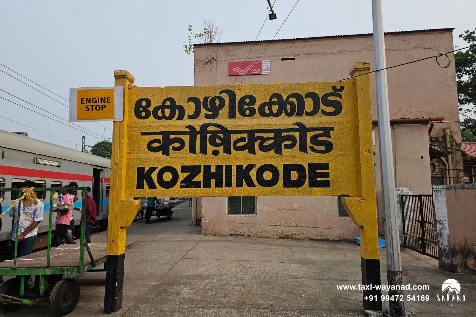 Kozhikode railway station name board, the nearest major railhead for a taxi to Wayanad