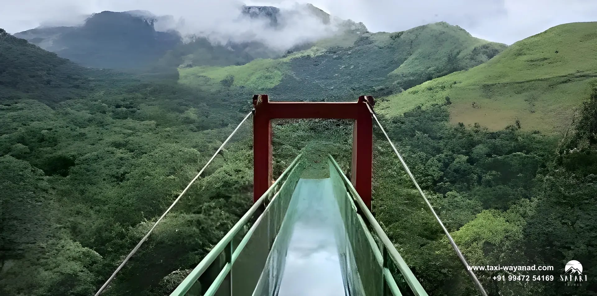 Glass bridge at 900 Kandi stretching over forested hills, Wayanad
