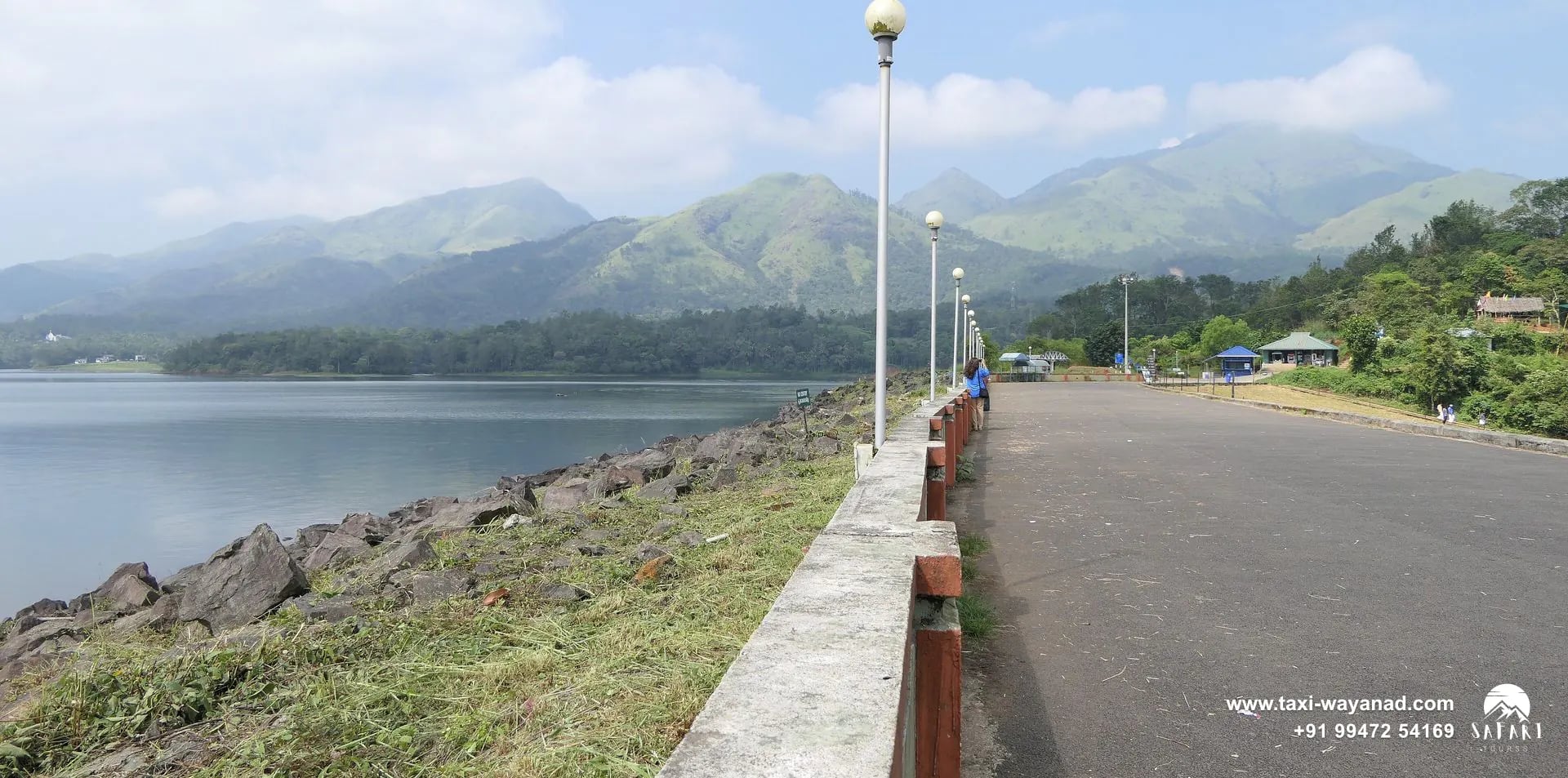 Walkway along the dam top beside the reservoir and hills at Banasura Sagar Dam, Wayanad