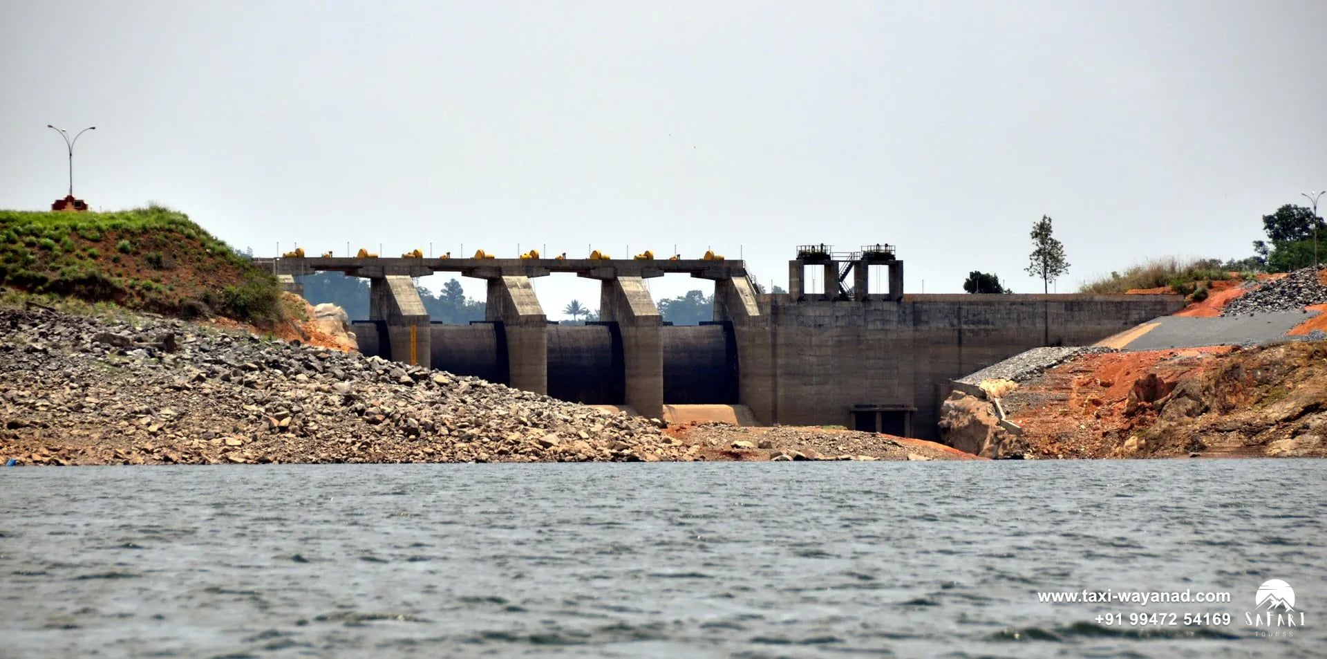 Spillway gates of Banasura Sagar Dam seen across the reservoir, Wayanad