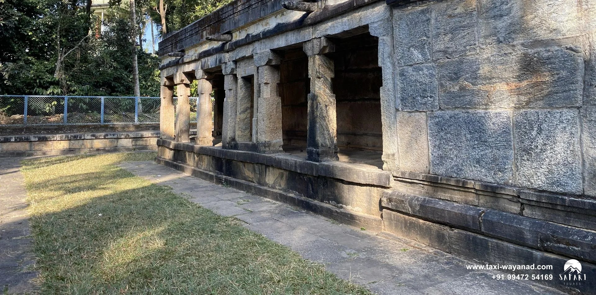 Long granite walls and pillared side of the Jain temple in Sulthan Bathery, Wayanad