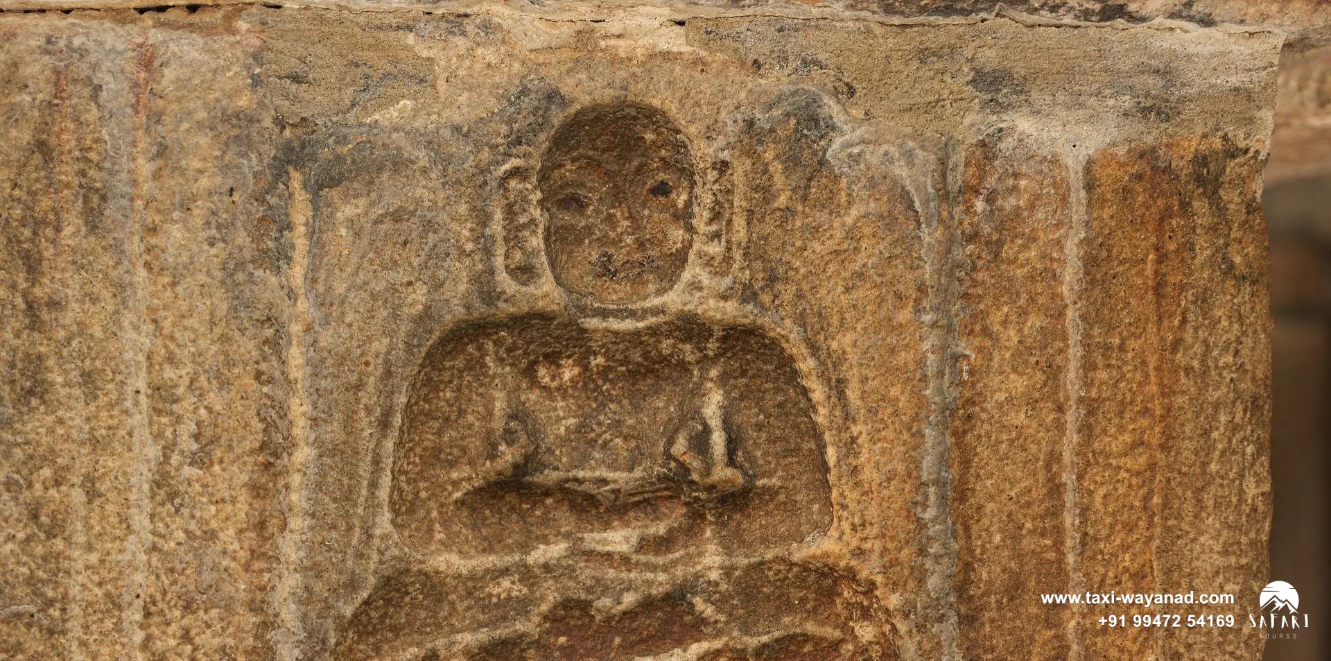 Seated Jain figure carved in relief on a granite pillar at the Jain temple, Sulthan Bathery, Wayanad