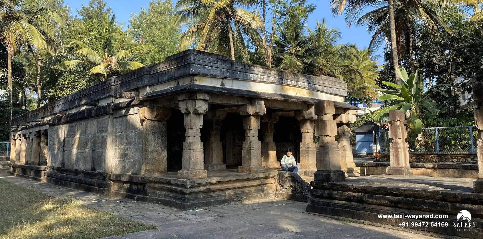 Medieval granite Jain temple among coconut palms in Sulthan Bathery, Wayanad