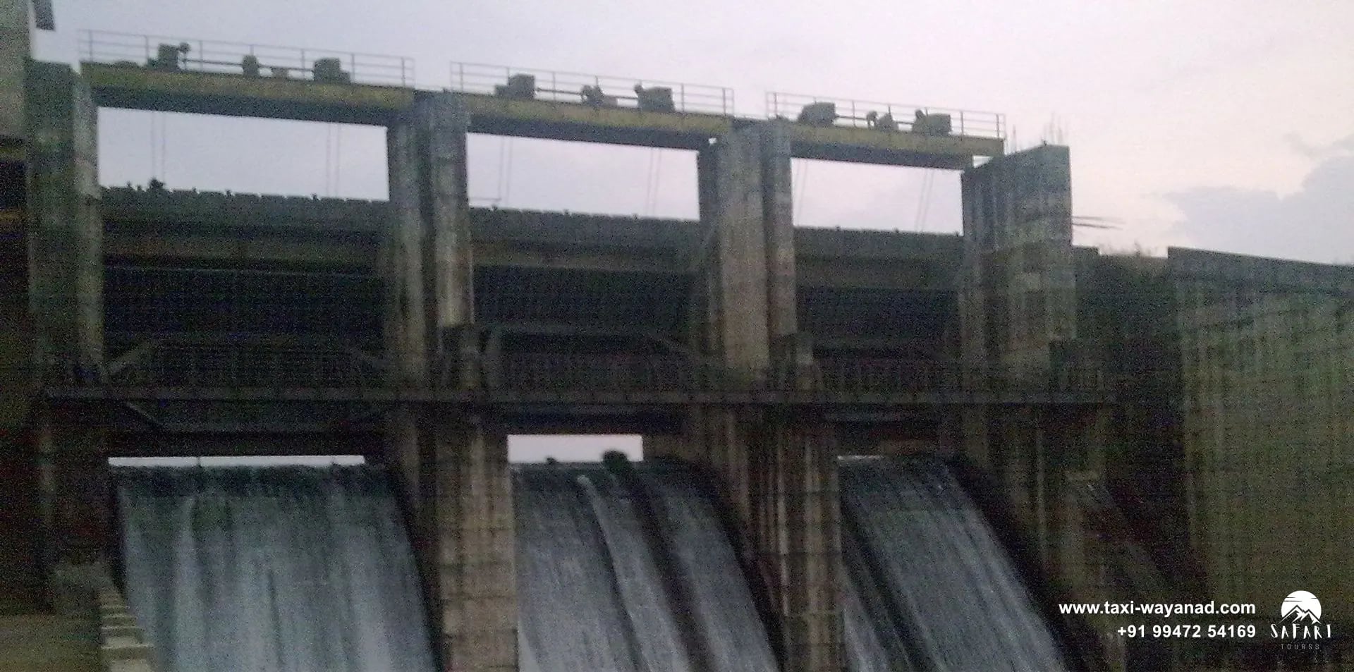 Water pouring through the open shutters of Karapuzha Dam, Wayanad