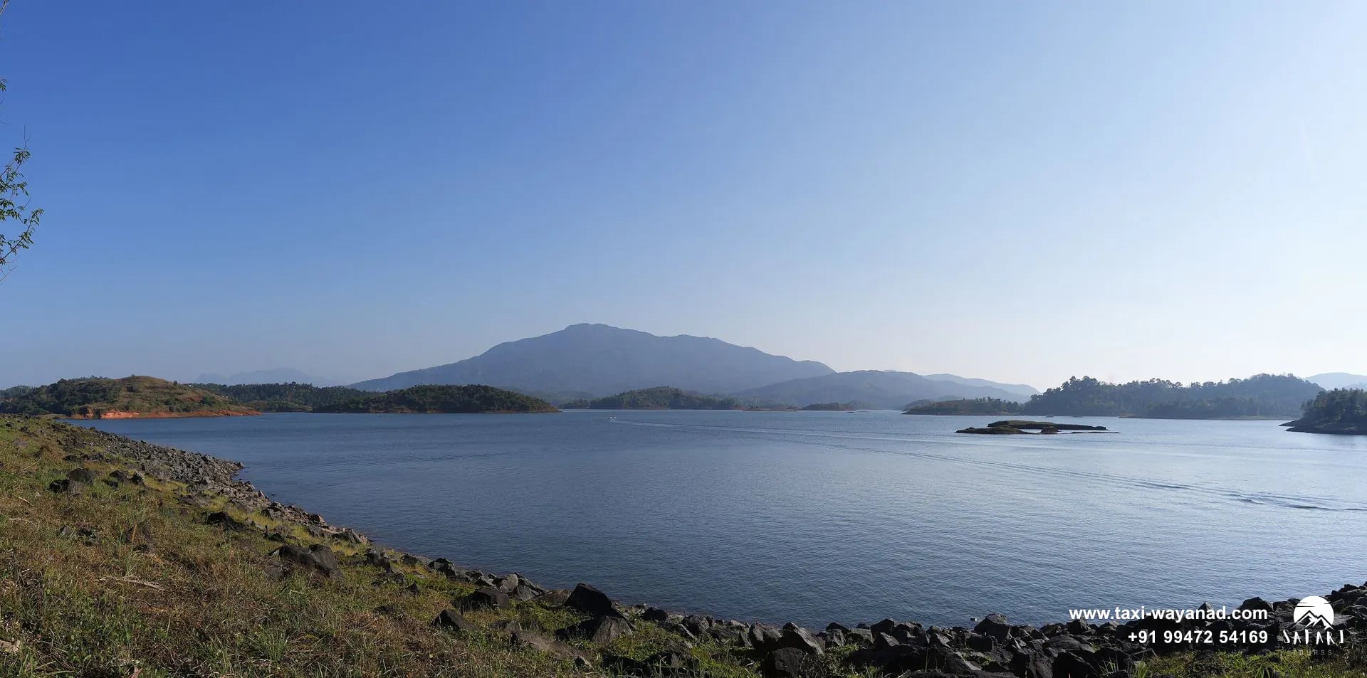 Wide view across the Karapuzha Dam reservoir with forested islands and hills, Wayanad