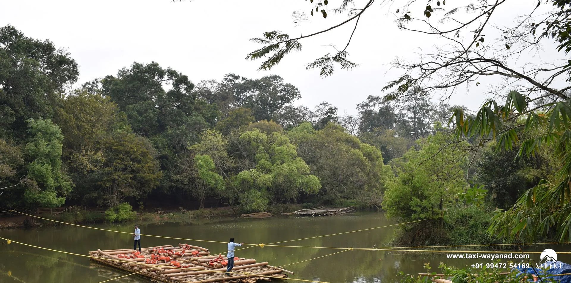 Bamboo raft ferrying visitors across the Kabini River to Kuruva Island, Wayanad