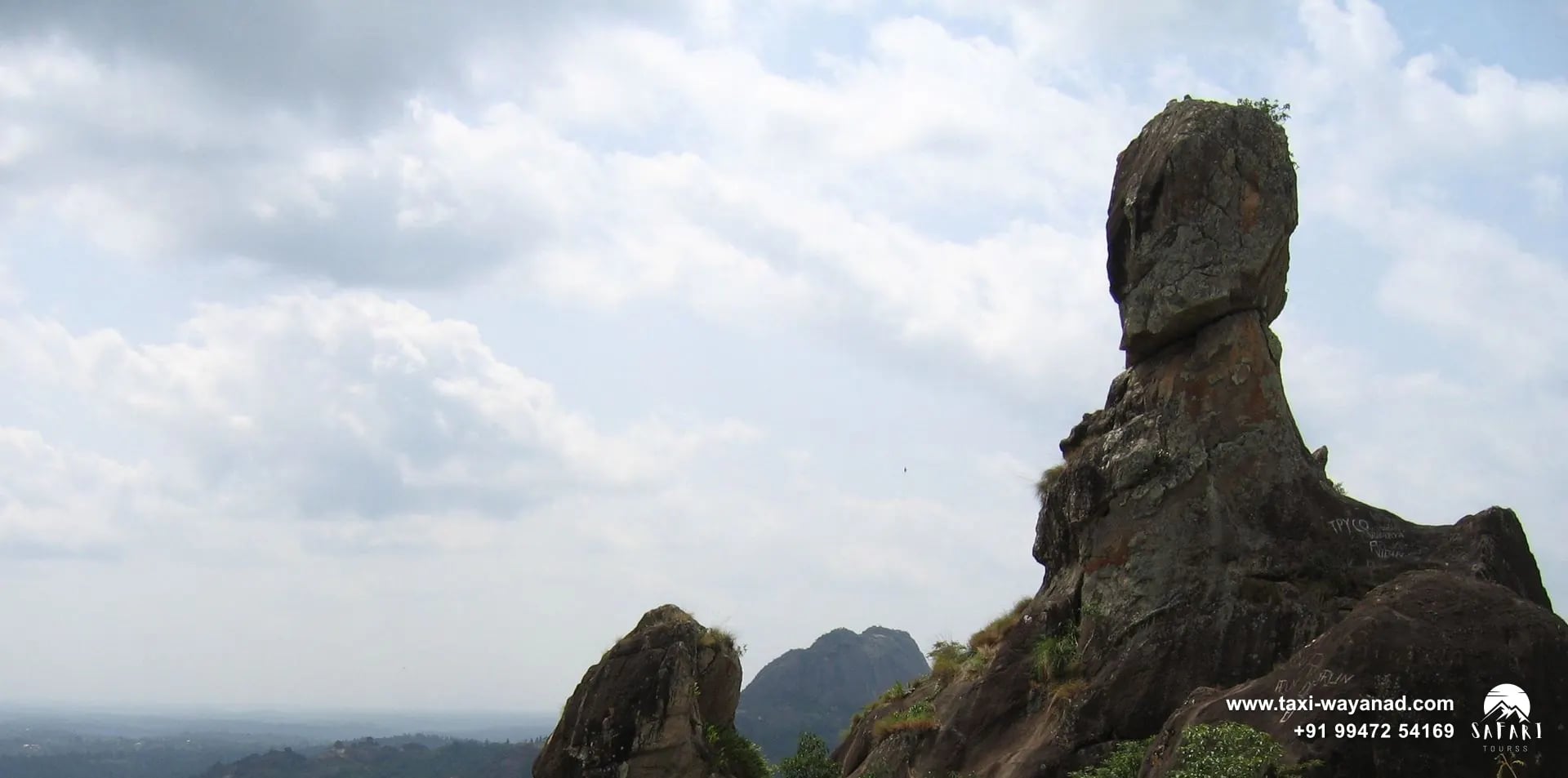 Skull-shaped Phantom Rock rising above the forested countryside near Ambalavayal, Wayanad