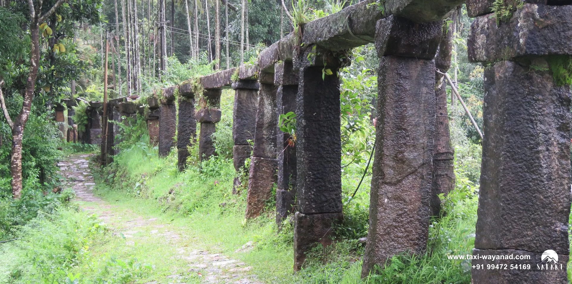 Ancient stone aqueduct on granite pillars beside Thirunelli Temple, Wayanad